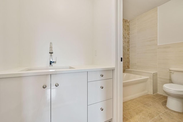 23 Northbrook Rd Unit 202, Spring Valley, NY 10977 - full bathroom featuring toilet, vanity, tile patterned flooring, and tile walls