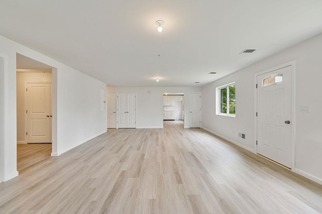 23 Northbrook Rd Unit 202, Spring Valley, NY 10977 - unfurnished living room featuring light wood finished floors and baseboards