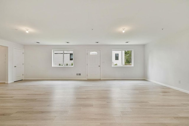23 Northbrook Rd Unit 202, Spring Valley, NY 10977 - unfurnished living room with light wood-type flooring and baseboards