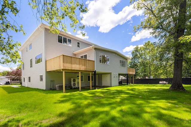 23 Northbrook Rd Unit 202, Spring Valley, NY 10977 - rear view of property featuring a yard, a wooden deck, ac unit, and central air condition unit