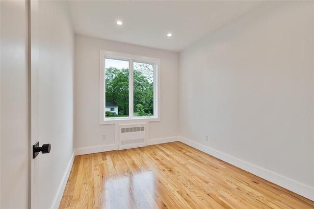 23 Northbrook Rd Unit 202, Spring Valley, NY 10977 - spare room featuring light wood-style floors, radiator, and recessed lighting