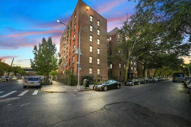 view of outdoor building at dusk