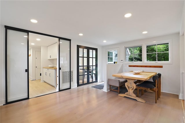 dining area featuring light hardwood / wood-style flooring and breakfast area