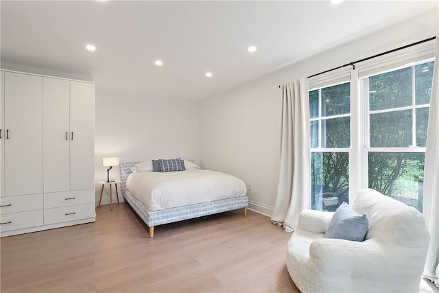 bedroom with light hardwood / wood-style floors