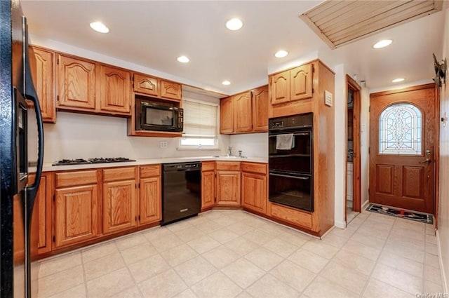 kitchen featuring sink and black appliances