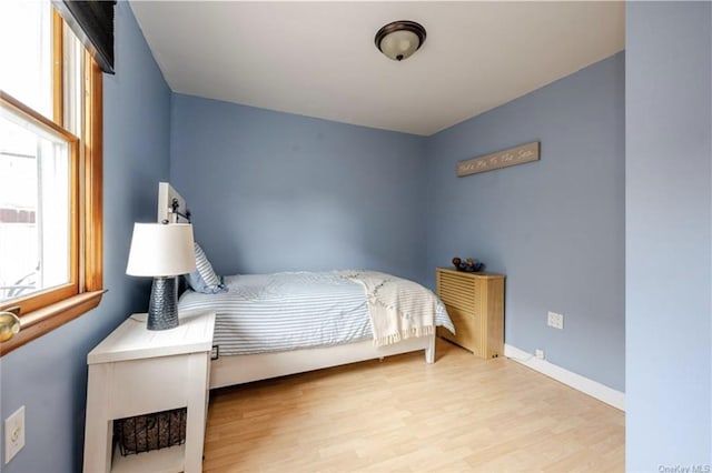 bedroom featuring light wood-type flooring