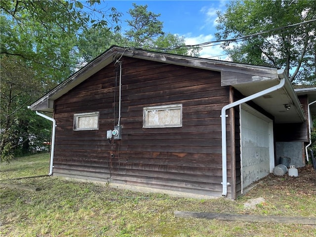 view of side of property featuring a garage