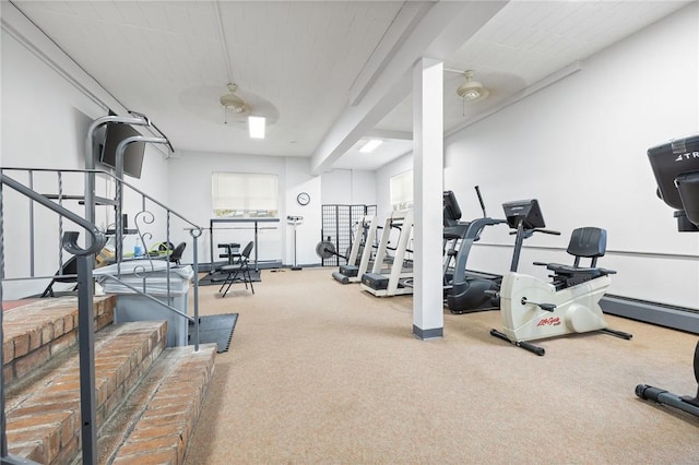 gym with ceiling fan and carpet floors