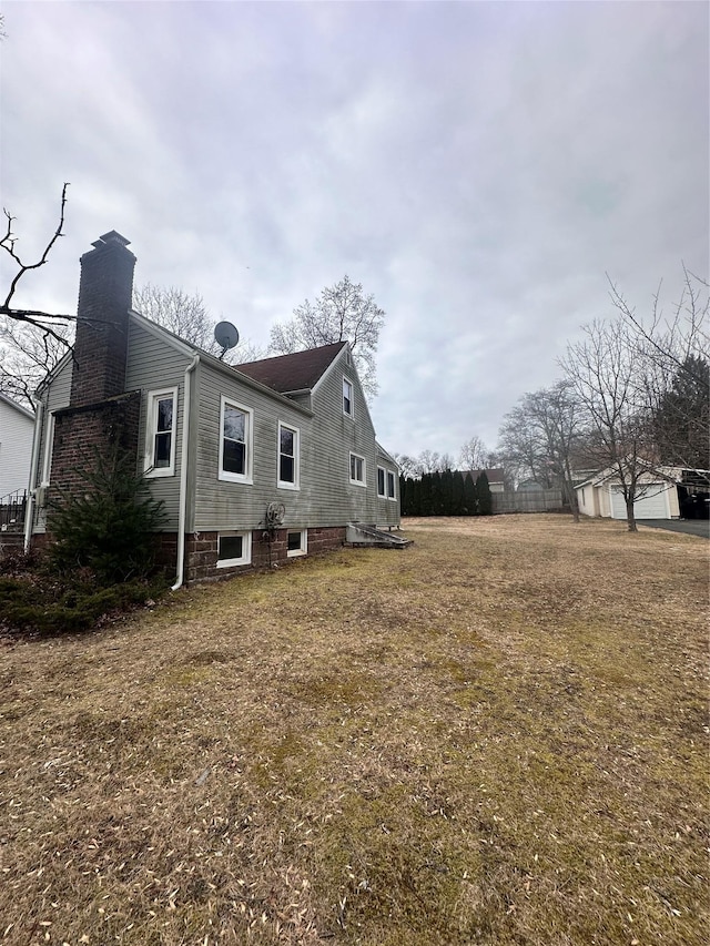 view of home's exterior featuring a yard