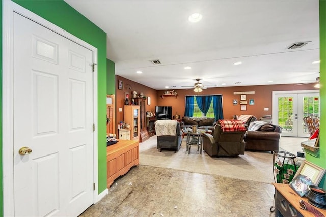 living room featuring french doors and ceiling fan