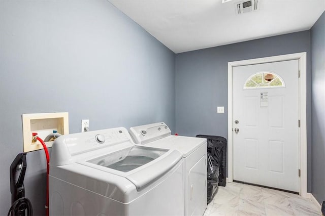 washroom with washing machine and dryer