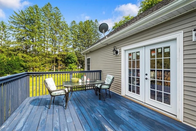 wooden deck featuring french doors