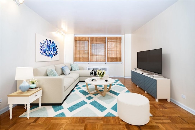 living room featuring parquet floors