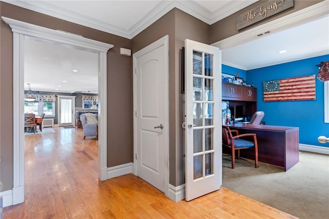 office featuring ornamental molding, french doors, and light hardwood / wood-style flooring