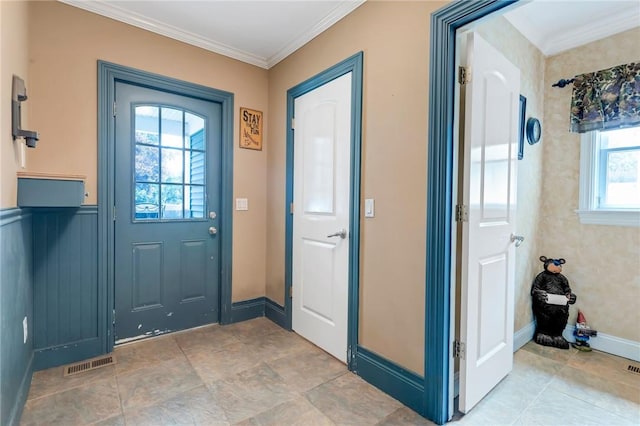 entryway featuring plenty of natural light and ornamental molding