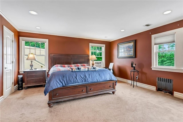 carpeted bedroom featuring radiator heating unit, multiple windows, and crown molding