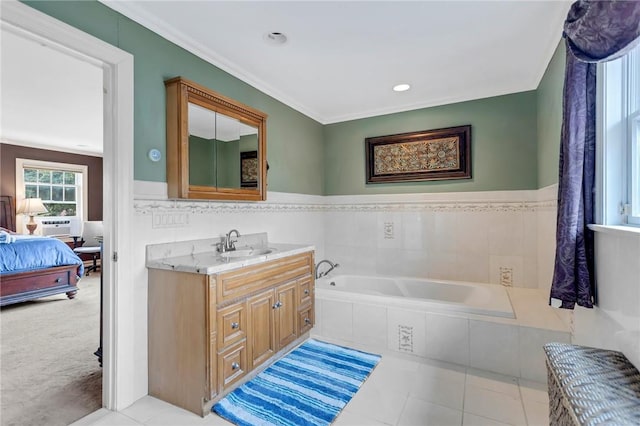 bathroom featuring vanity, tiled bath, tile patterned floors, and crown molding