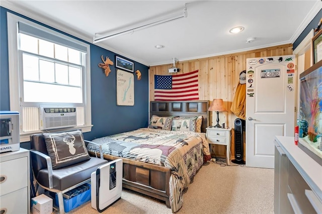 bedroom with light carpet, crown molding, cooling unit, and wooden walls