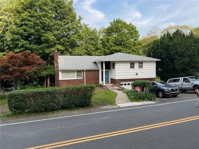 view of front of property with a garage