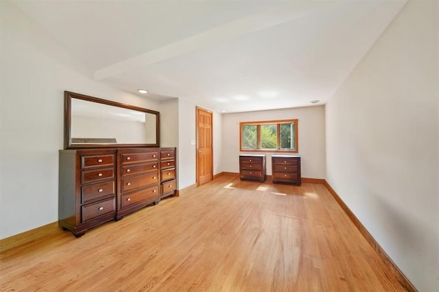 unfurnished bedroom with light wood-type flooring