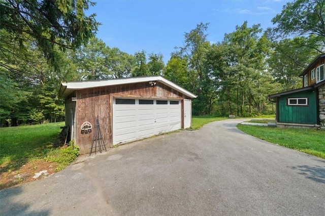 garage featuring a lawn