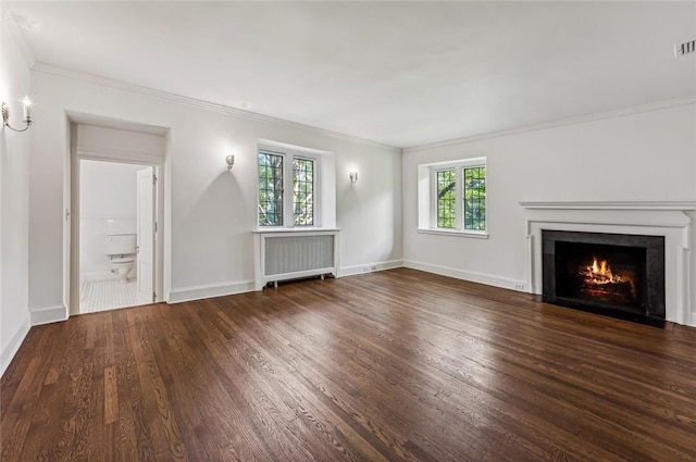 unfurnished living room with radiator heating unit, crown molding, and dark wood-type flooring