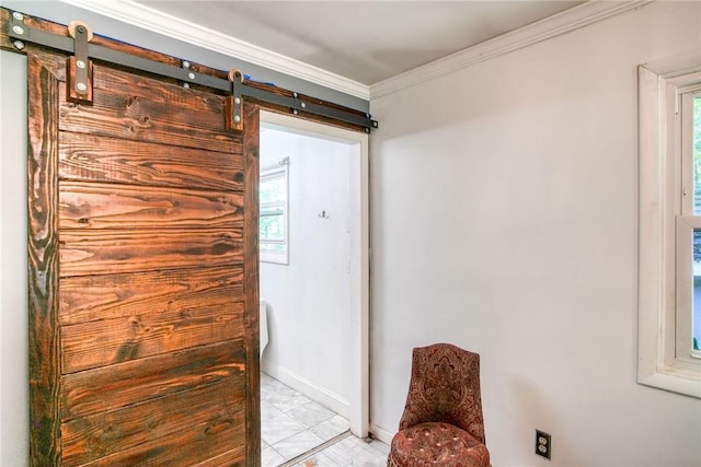 entryway with a barn door, plenty of natural light, and ornamental molding