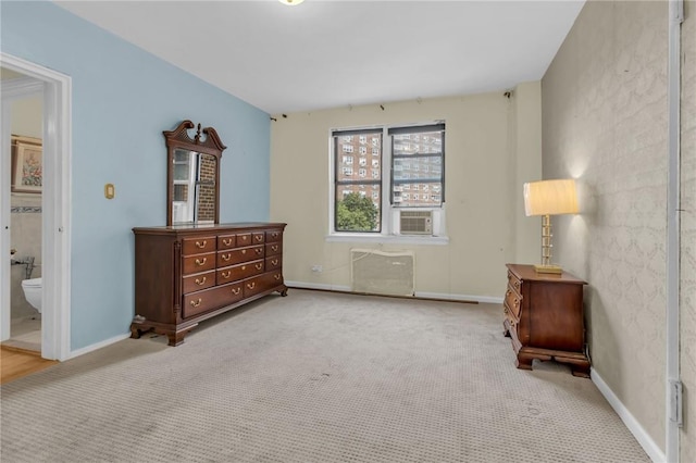 living area with cooling unit and light colored carpet