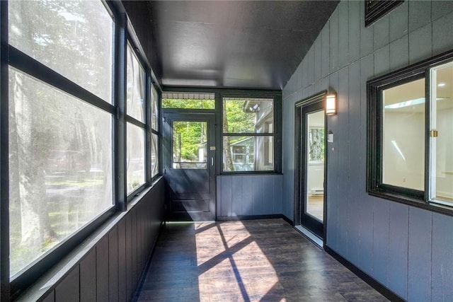 unfurnished sunroom with vaulted ceiling