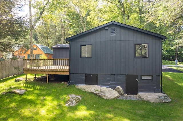 exterior space featuring a deck and a yard