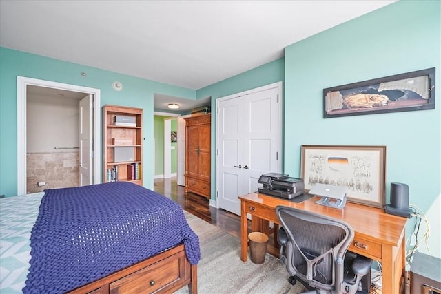 bedroom featuring dark hardwood / wood-style flooring and a closet