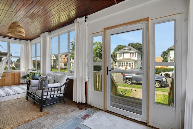 sunroom with wooden ceiling