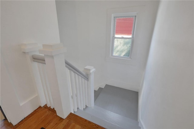 stairs with wood-type flooring