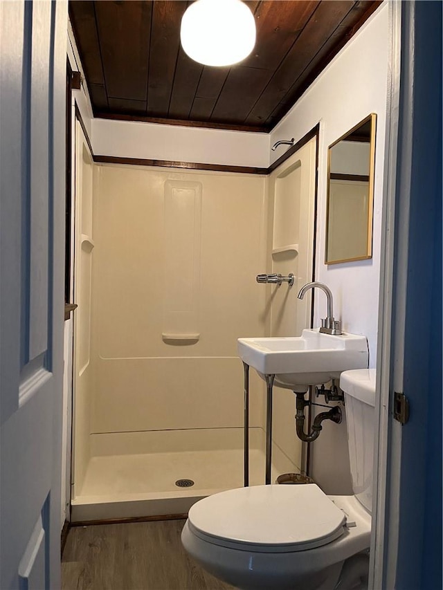 bathroom with a shower, wood-type flooring, wooden ceiling, and toilet