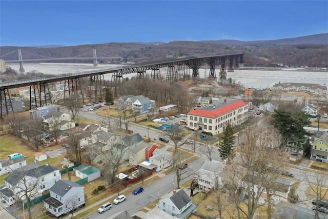 aerial view featuring a water and mountain view