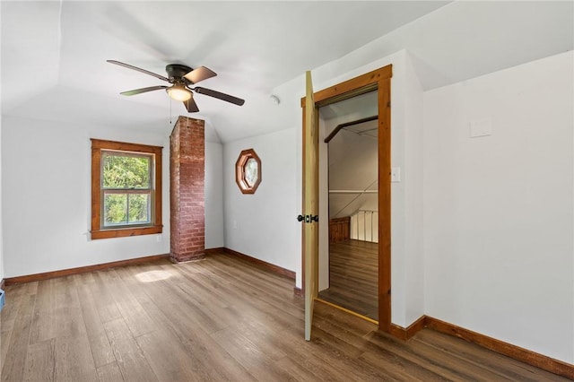 bonus room featuring hardwood / wood-style flooring, ceiling fan, and vaulted ceiling