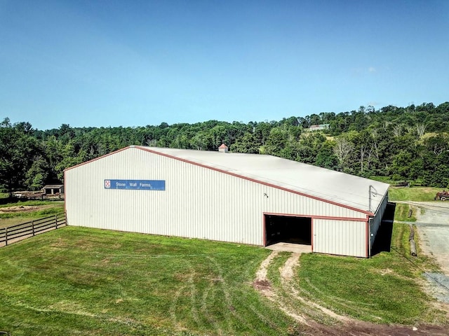 view of outdoor structure with a yard