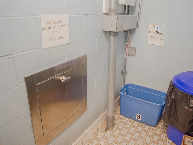 160 Academy St Unit 9L, Poughkeepsie, NY 12401 - bathroom featuring concrete block wall