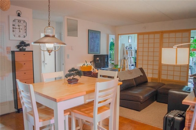 160 Academy St Unit 9L, Poughkeepsie, NY 12401 - dining space featuring wood finished floors