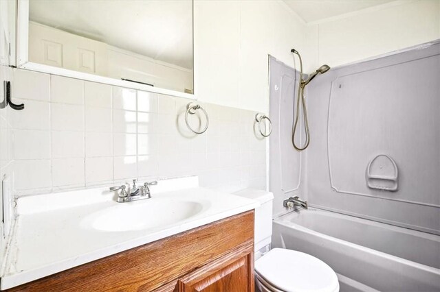 full bathroom with vanity,  shower combination, toilet, and backsplash