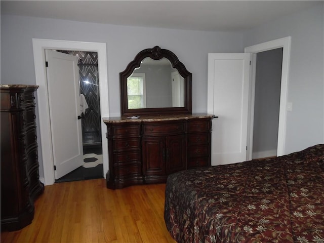 bedroom with a closet and light wood-type flooring