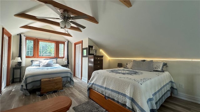 bedroom featuring lofted ceiling with beams, ceiling fan, and dark wood-type flooring