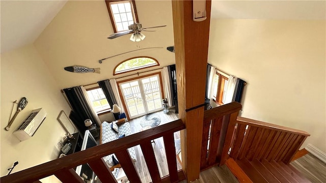 entrance foyer with ceiling fan, high vaulted ceiling, and wood-type flooring