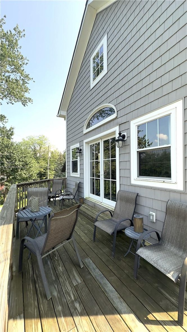 wooden deck featuring french doors