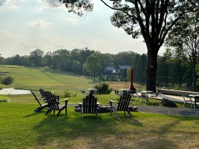 view of property's community featuring a yard