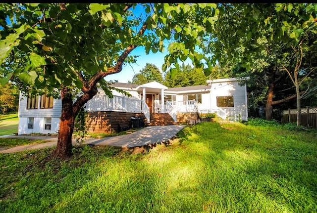 view of front of home with a front lawn