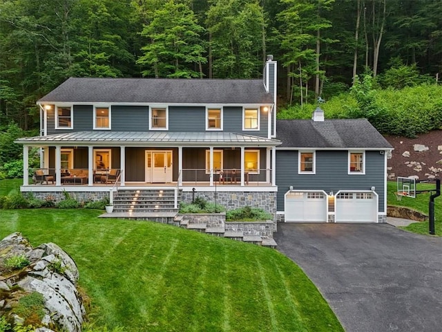 25 Red Oak Ln, Garrison, NY 10524 - view of front of home featuring a chimney, board and batten siding, driveway, and a porch