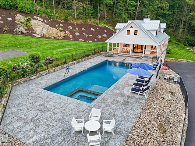 view of pool with a patio area and an in ground hot tub