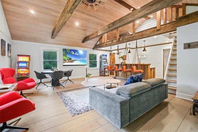 living room with light wood-type flooring, lofted ceiling with beams, and wood ceiling