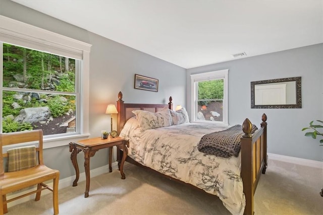 bedroom with light colored carpet